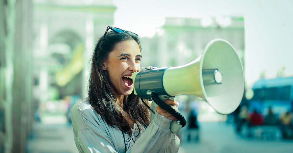 customer journey showing woman shouting advocacy on a megaphone