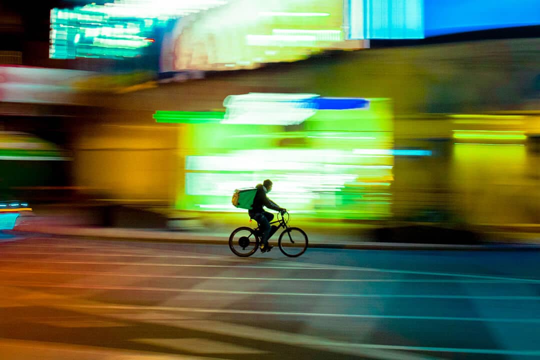 delivery guy on his bike travelling at speed