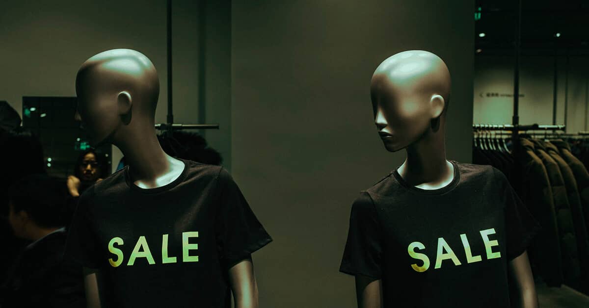 2 mannequins at a store with sale shirts on anticipating buyer's journey